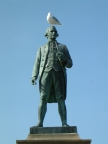 Statue with seagull on head